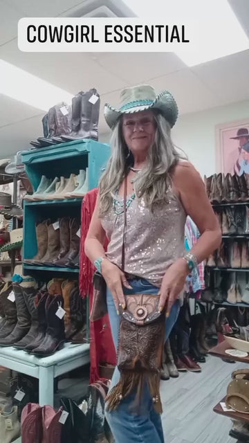 video showing a cowgirl model and her beautiful western crossbody purse